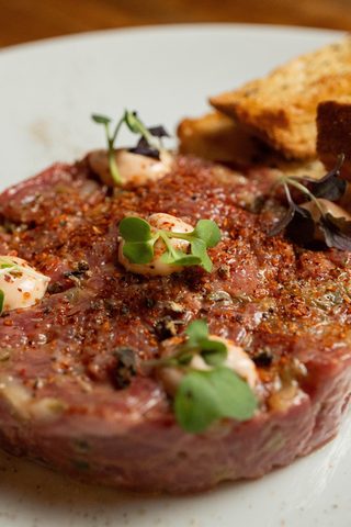 Close-up of steak tartare with sprouts