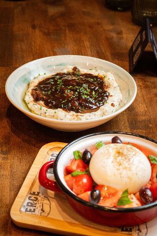 Braised pork cheek in dark sauce ringed with mashed potato